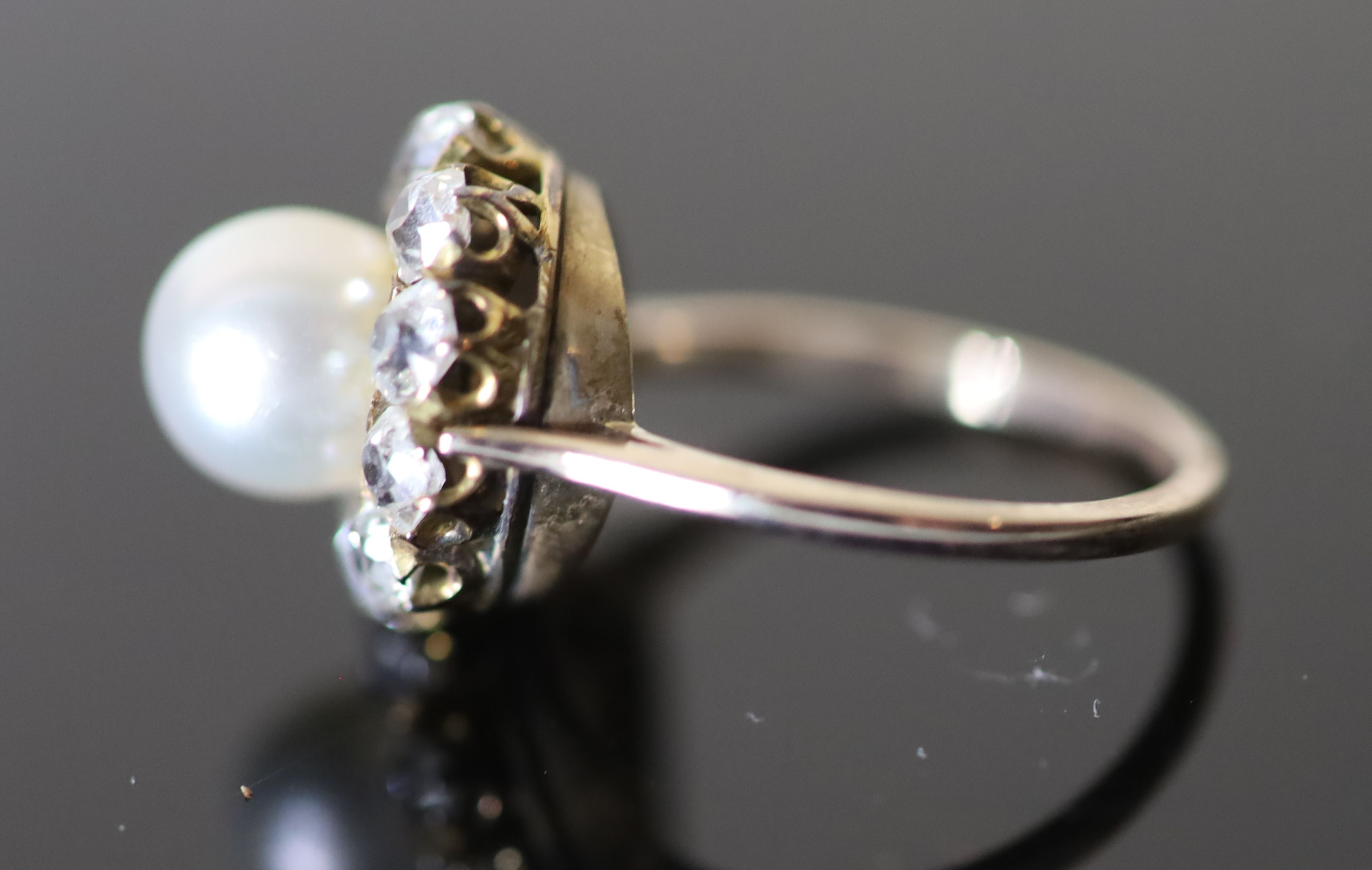 A modern gold, cultured pearl and diamond set circular cluster ring,